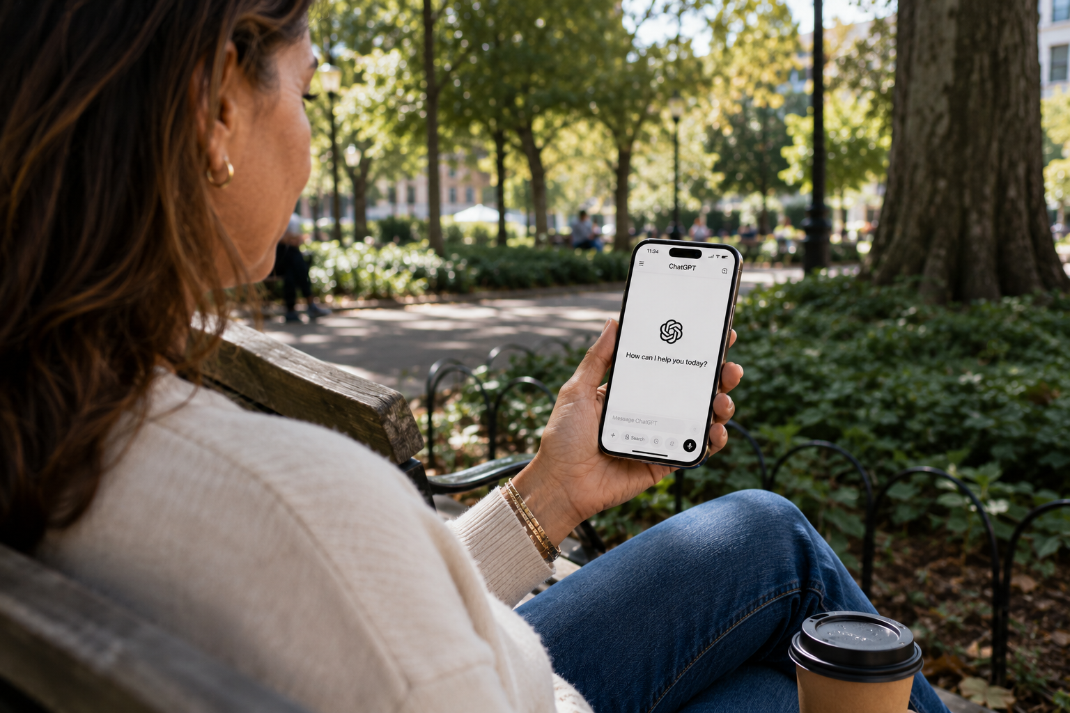 A hand holding a phone with the ChatGPT app open, showing that ChatGPT works easily on mobile devices